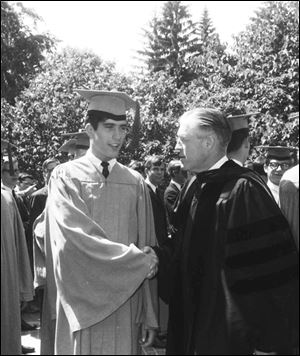 Mitt Romney and his father, Michigan Gov. George Romney, celebrate Mitt’s graduation in June, 1965.