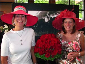 Linda Swemba, left, assistant show chairman, and Susie Kienzle, show chairman, donned colorful hats for the occasion.