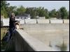  Dan Engel of Cincinnati uses a stepladder to fish at a wall along the Sandusky River in downtown Fremont.