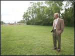  Charlie Oswanski, facilities and operations superintendent for the Toledo-Lucas County Public Library, surveys the property on King Road at Sylvania Avenue.