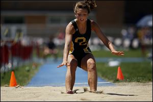 Emily Popovitch of Clay jumps 16-10 to win the girls' long jump. Teammate Nicole Breeden claimed the discus title with a throw measuring 140 feet, giving the Eagles a pair of field event victories