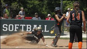 Perrysburg's Kimmy Granata scores against Ashland in the first inning of their Division I final Saturday. Granata had two hits and an RBI for the Yellow Jackets, who will face Elyria on Thursday.