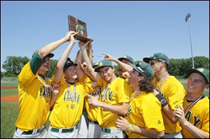 The Clay High School baseball team celebrates their Division I district trophy after beating Southview 5-2 at Mercy Field on Saturday. The Eagles have gone 10-5 since starting the season 2-9.