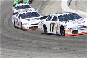 Chris Buescher leads Brennan Poole in the Menards 200 ARCA race at Toledo Speedway Sunday afternoon.

