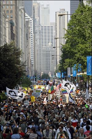 Protesters march down Michigan Ave. in Chicago during this weekend's NATO summit Sunday.