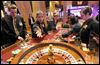  Robert Rodriguez, second from left, practices running a roulette wheel at Hollywood Casino Toledo on Monday. Mr. Rodriguez, who has never worked in a casino before but placed bets in casinos all over the world, said the smoke-free environment was his favorite thing about the casino. 