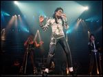  Nov. 13, 1988 file photo, pop singer Michael Jackson performs before a sold out crowd for his Bad tour at the Los Angeles Sports Arena. 