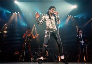 Nov. 13, 1988 file photo, pop singer Michael Jackson performs before a sold out crowd for his Bad tour at the Los Angeles Sports Arena. 