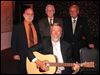  With the help of Maumee Judge Gary Byers on guitar, Joe Scalzo, Kenneth White, Sr., and Willard Johnson, in back from left, entertained members and guests of the Toledo bar Association Auxiliary event.