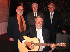 With the help of Maumee Judge Gary Byers on guitar, Joe Scalzo, Kenneth White, Sr., and Willard Johnson, in back from left, entertained members and guests of the Toledo Bar Association Auxiliary event.