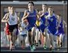  Kyle Lach of St. Francis leads the pack in winning the 1600-meter run at the Three Rivers Athletic Conference meet. Lach also won the event at the district.