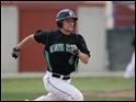 Andy King of the Ottawa Hills team gets a base hit during the first inning against Leipsic.