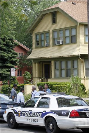 Toledo police investigate at 3122 Parkwood Ave. after receiving a call from a man that he had killed his girlfriend.