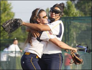 Notre Dame sophomore pitcher Cassie Gillespie right celebrates with Nikki Wilkins after the Eagles defeated North Royalton. Gillespie went the distance and struck out four, while hitting a home run and two doubles.