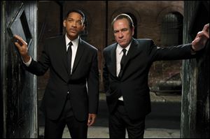 Tommy Lee Jones, right, and Will Smith are shown in a scene from 