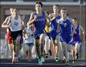 Kyle Lach of St. Francis leads the pack in winning the 1600-meter run at the Three Rivers Athletic Conference meet. Lach also won the event at the district.