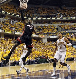 Miami Heat's LeBron James (6) shoots past Indiana Pacers' Danny Granger (33) in the second quarter of Game 6. 