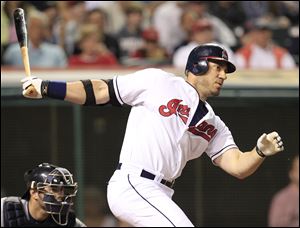 Cleveland Indians' Travis Hafner watches the ball after hitting into a fielders choice in the eighth inning in a baseball game against the Detroit Tigers to score Jason Kipnis.