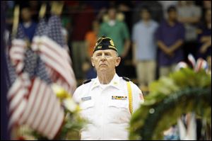 John Hatfield of American Legion Post 537 stands at attention after presenting the colors.