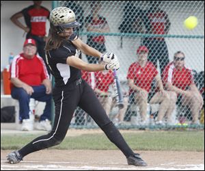 Perrysburg's Katie Dunphy connects for a home run in the first inning against Elyria during the Division I softball regional semifinal on Thursday. The Yellow Jackets finished the season 19-9.