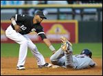  Cleveland Indians' Shelley Duncan, right, steals second base as Chicago White Sox shortstop Alexei Ramirez tries to make a tag during the second inning of a baseball game on Friday.