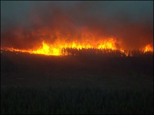This photo provided by the Michigan Department of Natural Resources shows a wildfire in Michigan's Upper Peninsula. 