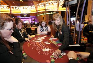 Sue Utter practices dealing blackjack at Hollywood Casino Toledo. Experts say card counters and cheaters could target the casino.