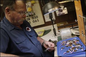 Dennis Bryant fashions his custon lures in Toledo with input from anglers and charter boat captains.