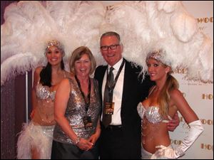 Nancy and Tim Alter pose with show girls during VIP night at the Hollywood Casino Toledo.