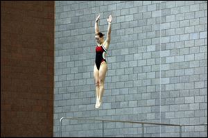 Cheyenne Cousineau, a Bedford High School graduate, prepares to dive during a meet. Now a third-year sophomore at Ohio State University, Cousineau returned to diving six months after suffering a stroke.