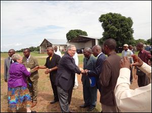 Bishop Bruce Ough visits the Democratic Republic of Congo. The 'miracle offering' at this year's meeting will go toward the $1.6 million cost of a refurbished plane to use in Congo's remote provinces.