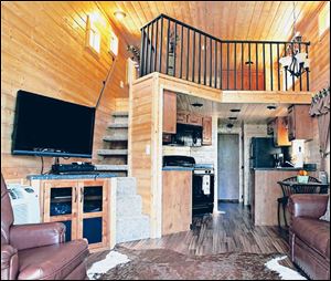 The interior of a Ventura Ranch Comfort Cabin at a KOA campground in Santa Paula, Calif., shows the range of options that have made sleeping in the great outdoors more comfortable than ever.