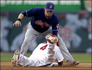 St. Louis Cardinals' Yadier Molina (4) is caught stealing second as Cleveland Indians shortstop Asdrubal Cabrera applies the tag in the sixth inning of a baseball game, Saturday.