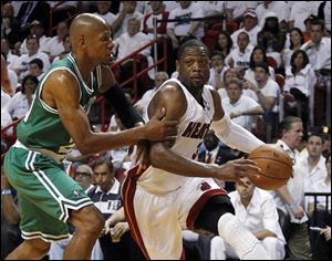 Miami Heat's Dwyane Wade (3) drives as Boston Celtics' Ray Allen defends during the first half of Game 7 of the NBA basketball playoffs Eastern Conference finals, Saturday.