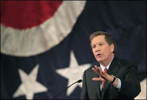Gov. John Kasich warns of a likely drop in job growth, blaming Washington. 