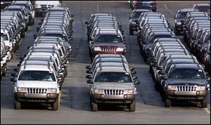 Rows of 2001 Jeep Grand Cherokees are lined up outside the Jefferson North Assembly Plant in Detroit.