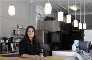 Kristin Kiser says Black Kite Coffee is a labor of love. The growth downtown is promising, she said, and the Old West End could benefit from similar development.