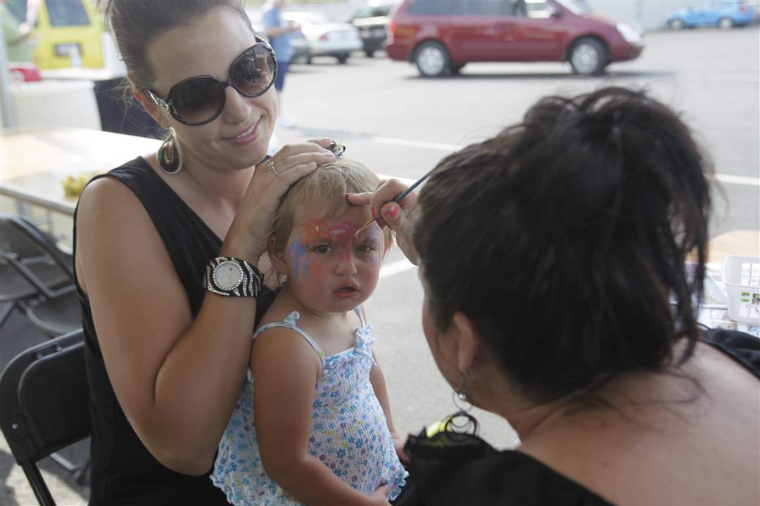 Michelle-Zepeda-of-Perrysburg-left-holds-her-daughter-Kenzley-Zepeda