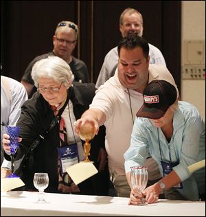 Joan Freedman, of Worcester, Mass., left; Peter Lewnes, of Allentown, Penn.; and Marian Burke, of Greenwich, Conn.; in the first round of the goblet grab.