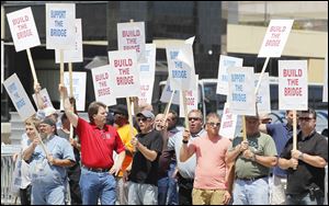 Supporters of a second bridge between Detroit and Windsor gather in Detroit on Friday. A recent study estimated 12,000 jobs will be needed for its construction.