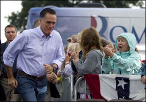 Republican presidential candidate Mitt Romney arrives for a campaign stop at Mapleside Farms today in Brunswick, Ohio.  