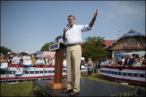 Republican presidential candidate, former Massachusetts Gov. Mitt Romney gestures during a campaign stop at Bavarian Inn Lodge in Frankenmuth, Mich.  