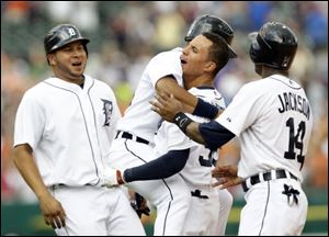 Detroit Tigers center fielder Quintin Berry, third from left, celebrates after hitting an RBI-single in the 10th inning of a game against the St. Louis Cardinals. 