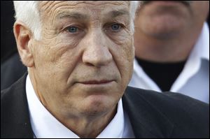 One of Jerry Sandusky's adopted sons has told authorities the former Penn State assistant football coach abused him, the son's lawyers said.
