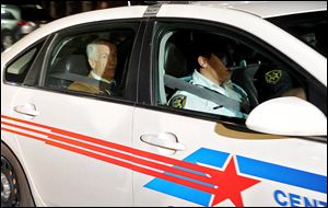 Jerry Sandusky leaves the Centre County Courthouse in Bellefonte after being charged with multiple counts of sexual abuse.