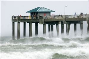 as wind, waves, and storm from Tropical Storm Debby pound the Florida ...
