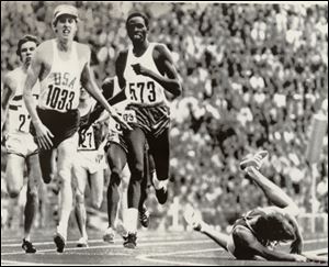 Dave Wottle, a Bowling Green graduate, wins the gold medal in the 800 final as the Soviet Union's Evgeny Arzhanov falls at the finish.