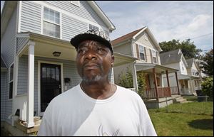 Zettie Williams lives in the last occupied house built by the Warren-Sherman Area Council on the 2200 block of Kent Street. Seven houses were built on the street.