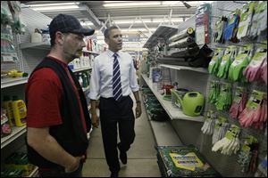 President Obama stopped at Fred's Pro Hardware during his 2011 visit to Toledo and picked out a pair of green and white gardening gloves for the First Lady with the help of store employee Matthew Wamsley.