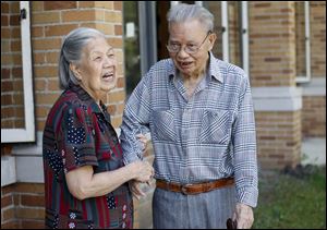 Loo Yuke Sau, with his wife, Loo Yuk Ying, at the Asian Senior Center, says he does physical exercise for a total of an hour every day.